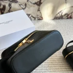 It can be carried by hand or worn crossbody, and it's very comfortable to wear-box - Image 4