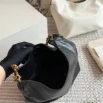 Classic black tone meets the iconic Y-signature V-shaped quilting-box - Image 6