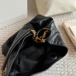 Classic black tone meets the iconic Y-signature V-shaped quilting-box - Image 5