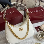 Warm off-white full-grain leather paired with vintage antique gold hardware-box