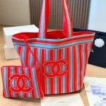 Tote bag style with red and blue contrast stripes, front embroidery, and red leather top handles-no box