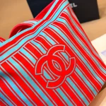 Tote bag style with red and blue contrast stripes, front embroidery, and red leather top handles-no box - Image 7