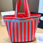 Tote bag style with red and blue contrast stripes, front embroidery, and red leather top handles-no box - Image 5