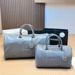Black and gold Boston bag with front embossed CC logo, gold lock, and round leather tag-no box - Image 2