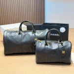 Black and gold Boston bag with front embossed CC logo, gold lock, and round leather tag-no box - Image 11
