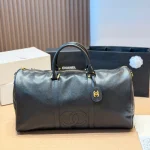 Black and gold Boston bag with front embossed CC logo, gold lock, and round leather tag-no box - Image 10