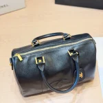 Black and gold Boston bag with front embossed CC logo, gold lock, and round leather tag-no box - Image 7