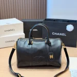 Black and gold Boston bag with front embossed CC logo, gold lock, and round leather tag-no box - Image 6