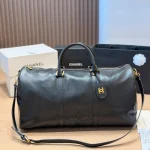 Black and gold Boston bag with front embossed CC logo, gold lock, and round leather tag-no box - Image 5