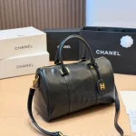 Black and gold Boston bag with front embossed CC logo, gold lock, and round leather tag-no box - Image 4