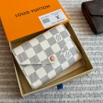 The white checkered coin purse from L is absolutely gorgeous-box