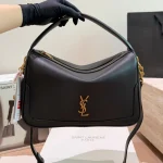 "Lunchbox bag. This handbag is a spacious shoulder bag that looks gorgeous whether worn on the shoulder or carried by hand-no box