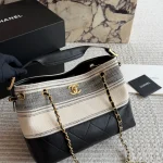 Striped bucket bag. Classic striped canvas with a metal chain-box