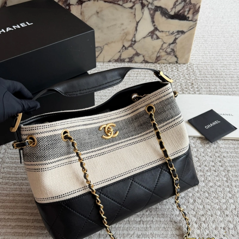 13427795696836000 Striped bucket bag. Classic striped canvas with a metal chain-box - Image 1