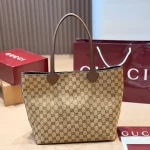 Large tote bag featuring floral canvas and red & green striped webbing, with brown leather handles-no box - Image 9