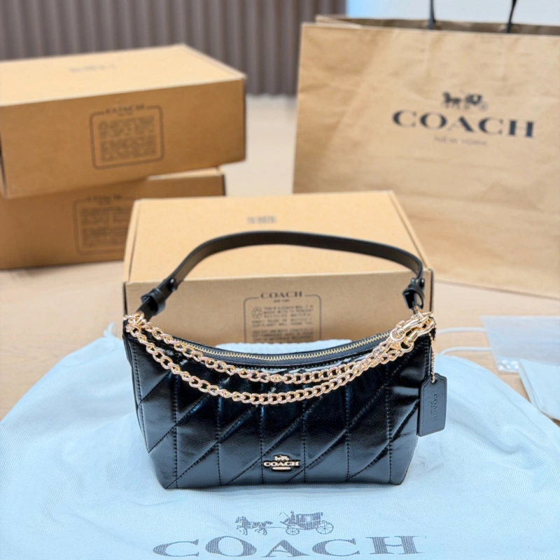 13428140758601200 This underarm bag features shiny cowhide leather, in a classic black colorway with a metal chain-box - Image 1