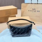 This underarm bag features shiny cowhide leather, in a classic black colorway with a metal chain-box - Image 4