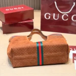 Fabric featuring the iconic green-red-green web stripe, paired with brown leather handles and a detachable shoulder strap-no box - Image 6