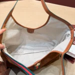 Fabric featuring the iconic green-red-green web stripe, paired with brown leather handles and a detachable shoulder strap-no box - Image 3