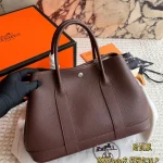 Garden Bag in premium Togo cowhide, incredibly soft to the touch. Features steel hardware, hand-stitched wrist strap, and authentic original lining-box - Image 2
