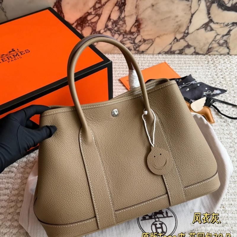 13428814325971600 Garden Bag in premium Togo cowhide, incredibly soft to the touch. Features steel hardware, hand-stitched wrist strap, and authentic original lining-box - Image 1