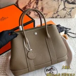Garden Bag in premium Togo cowhide, incredibly soft to the touch. Features steel hardware, hand-stitched wrist strap, and authentic original lining-box - Image 13