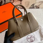 "Garden bag crafted from full-grain Togo cowhide, featuring a soft texture. Equipped with steel hardware, hand-stitched wrist strap, and original lining-box - Image 3