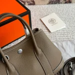 "Garden bag crafted from full-grain Togo cowhide, featuring a soft texture. Equipped with steel hardware, hand-stitched wrist strap, and original lining-box - Image 2