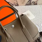 "Garden bag crafted from full-grain Togo cowhide, featuring a soft texture. Equipped with steel hardware, hand-stitched wrist strap, and original lining-box - Image 6