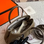 "Garden bag crafted from full-grain Togo cowhide, featuring a soft texture. Equipped with steel hardware, hand-stitched wrist strap, and original lining-box - Image 4