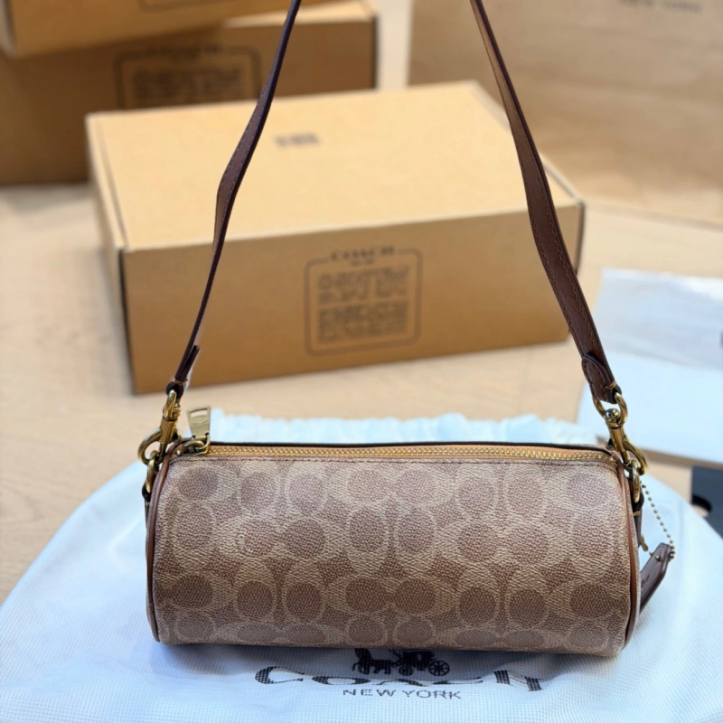 13429073467359600 Features a slim leather strap. Wear it as a top handle, shoulder bag, or crossbody-box - Image 1