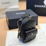 Mini backpack in black pebbled calfskin with gold-tone accents-box - Image 3