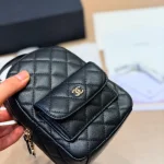 Mini backpack in black pebbled calfskin with gold-tone accents-box - Image 2