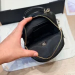 Mini backpack in black pebbled calfskin with gold-tone accents-box - Image 8