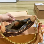 Featuring a uniquely shaped silhouette, it's also known as a moon bag-box - Image 4