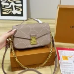 Features an adjustable strap for crossbody or underarm wear. Multiple ways to carry-box