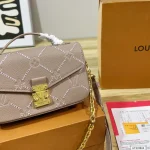 Features an adjustable strap for crossbody or underarm wear. Multiple ways to carry-box - Image 2