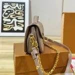 Features an adjustable strap for crossbody or underarm wear. Multiple ways to carry-box - Image 10