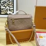 Features an adjustable strap for crossbody or underarm wear. Multiple ways to carry-box - Image 9