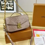 Features an adjustable strap for crossbody or underarm wear. Multiple ways to carry-box - Image 8