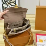 Features an adjustable strap for crossbody or underarm wear. Multiple ways to carry-box - Image 5