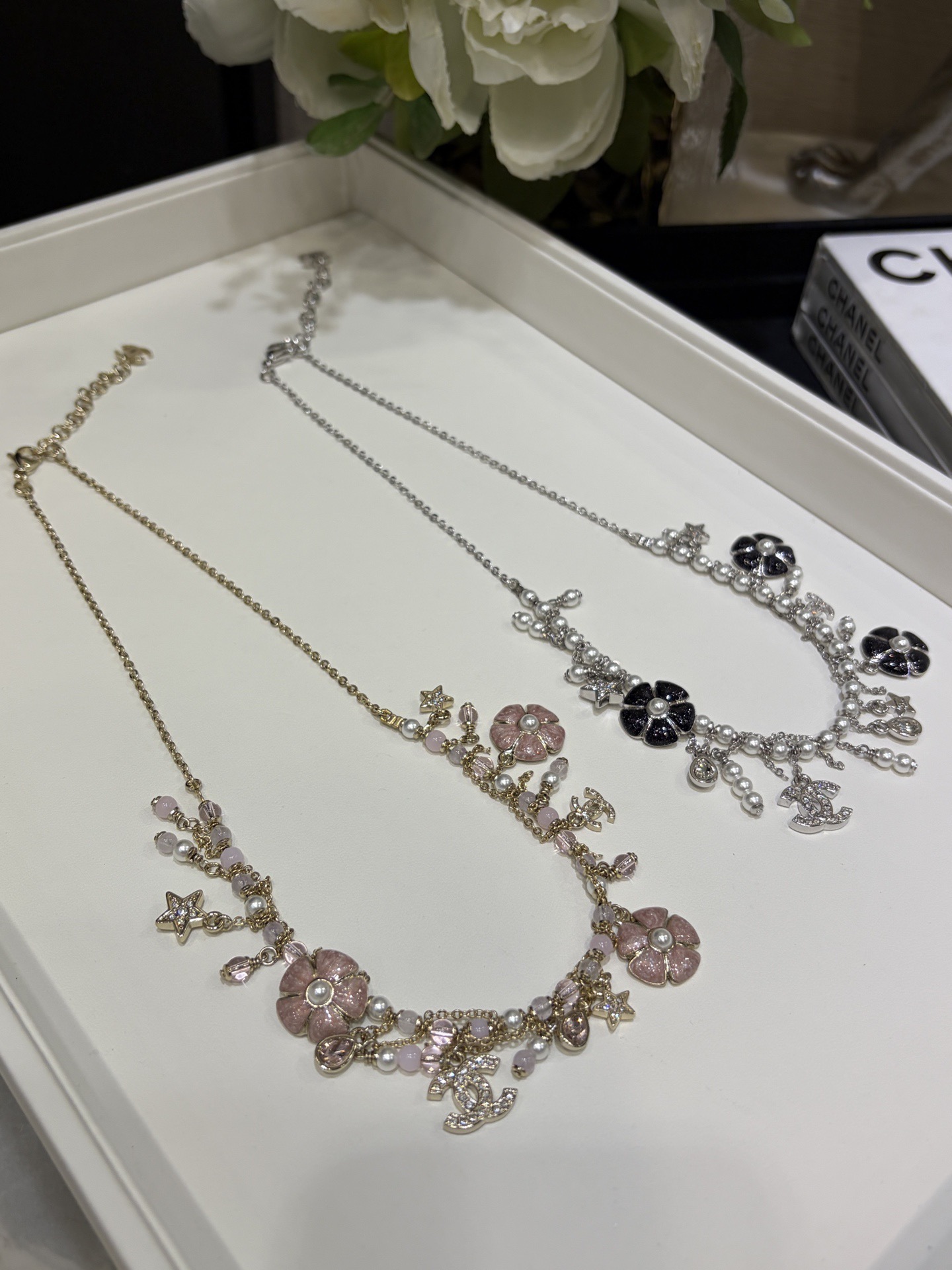 wsxc1789134453579_0 Chanel 26C New Camellia Pearl Tassel Necklace, Available in Pink & Black - Image 1