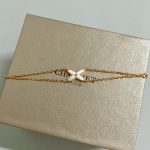 Chaumet White Mother-of-Pearl Criss-Cross Double Chain Bracelet,  gold-toned / white gold-toned