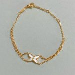 Chaumet White Mother-of-Pearl Criss-Cross Double Chain Bracelet,  gold-toned / white gold-toned - Image 3