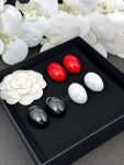 Chanel 26B Oval Enamel Double C Earrings, available in white, red, and black