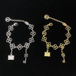 LV Openwork Monogram Flower Key & Petite Malle Charm Bracelet - Gold Tone / Silver Tone - Image 3