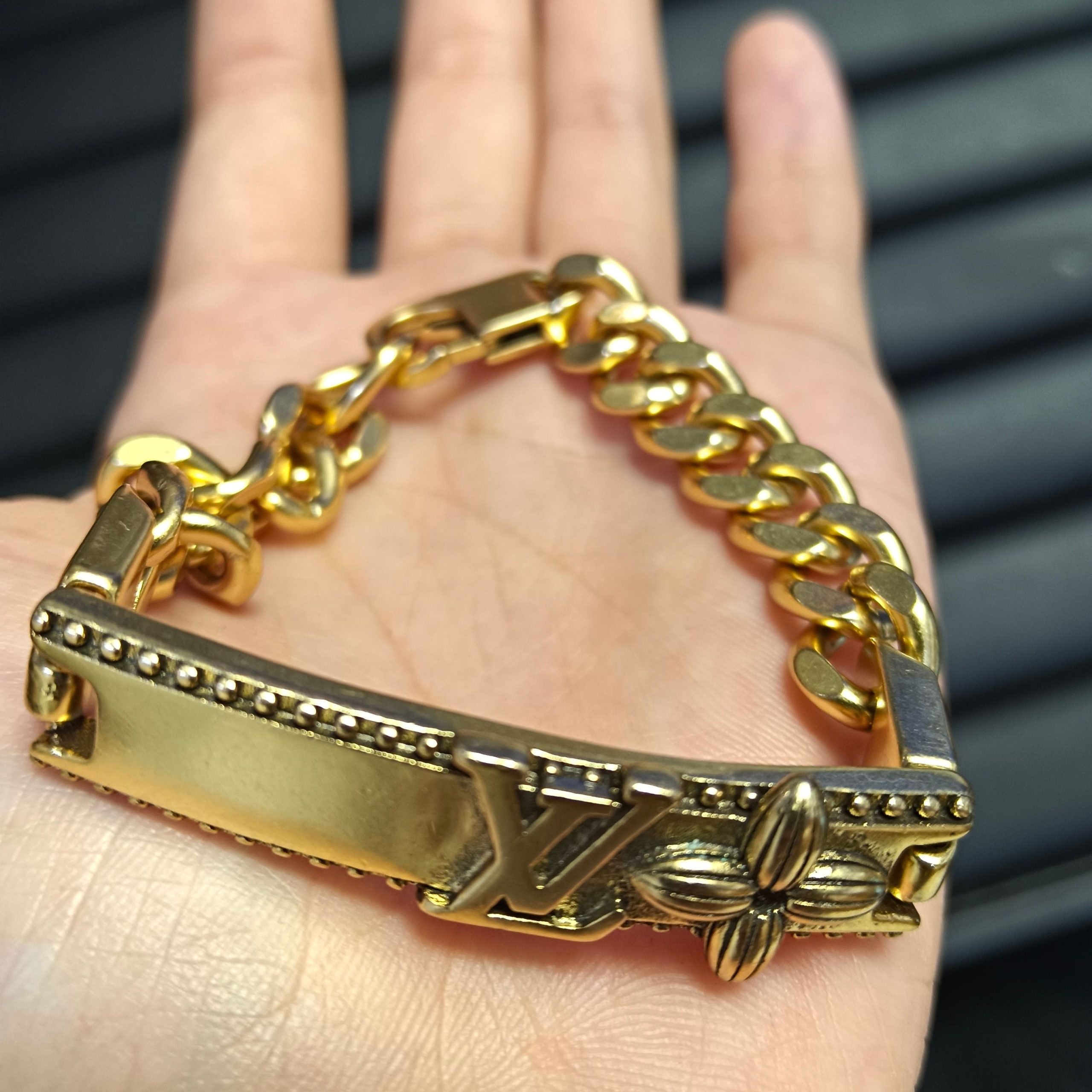 wsxc1789554903845_0 LV Link Bracelet: Vintage-Finish Plate with Embossed LV Logo & Monogram Flower, Gold/Silver Tone Curb Chain - Image 1