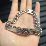 LV Link Bracelet: Vintage-Finish Plate with Embossed LV Logo & Monogram Flower, Gold/Silver Tone Curb Chain - Image 2