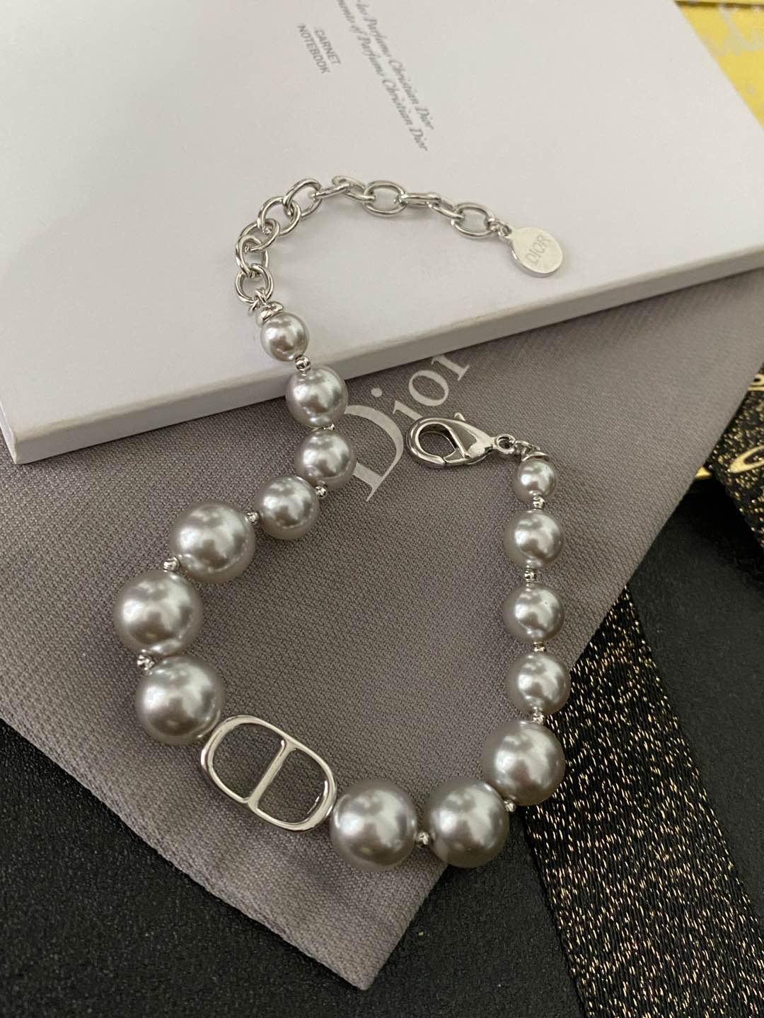 wsxc1789659426530_0 Dior Silver Grey Faux Pearl Bracelet (Vintage CD Clasp Charm) - Image 1
