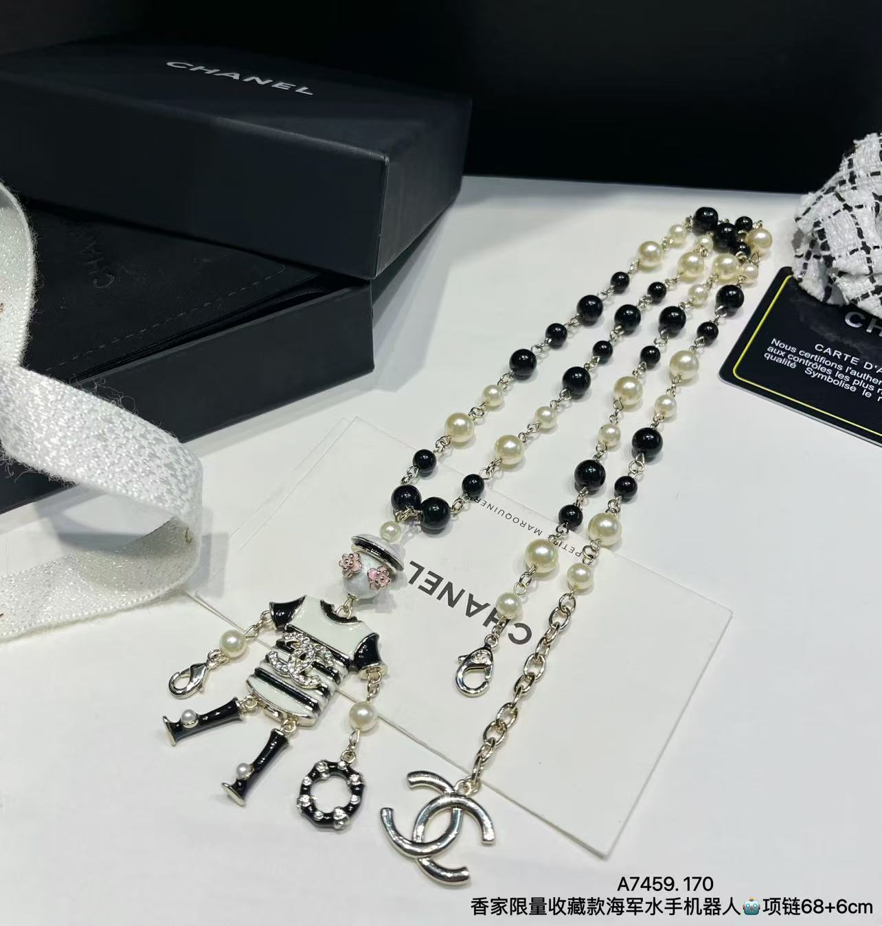 wsxc1789663750999_0 Chanel Limited Edition Black & White Faux Pearl Sweater Chain with Enamel Sailor Robot Charm (Interlocking CC Long Necklace) - Image 1